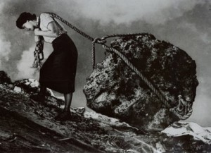 Woman dragging boulder