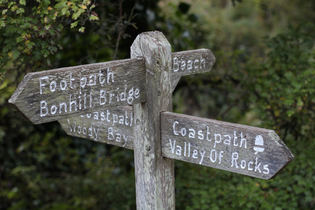 Old wooden signpost crossroads