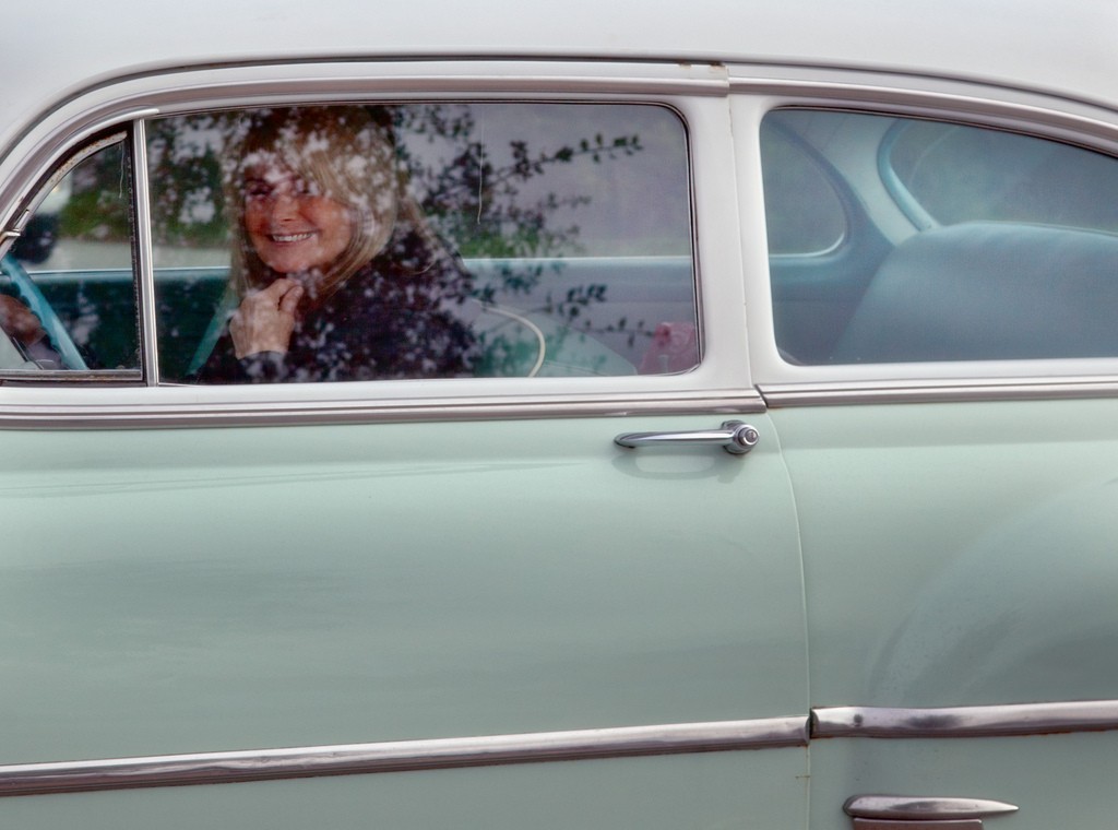 Smiling woman driving Chevrolet