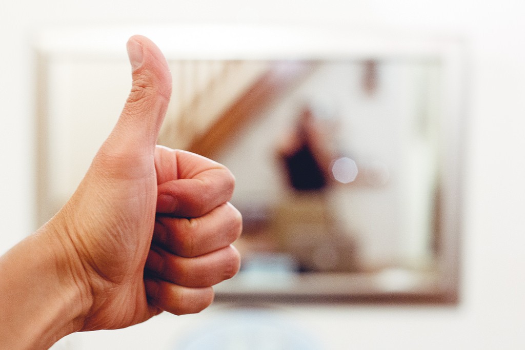 A thumbs up or other hand signal can help you turn away from harsh self-criticism